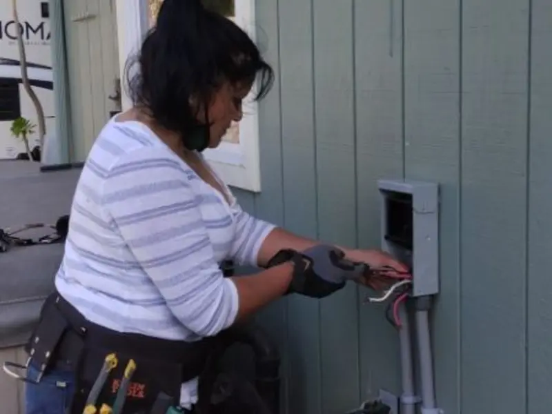 Licensed electrician wiring an exterior subpanel in Peekskill